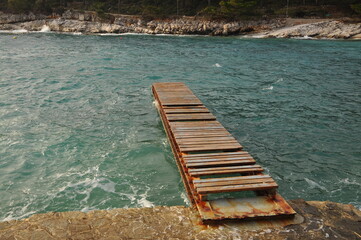 Old abandoned wooden pier in the sea, Island Losinj.