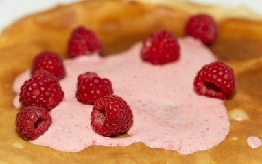 Pancakes with cream and raspberries. Vitamin Dessert.