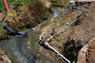 Photography of the view of the wastewater flow from the Arjuna temple tourist bathroom.