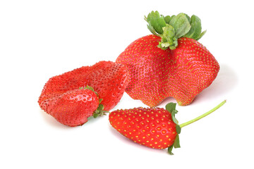 Three tasty strawberries isolated on white