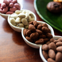 Almond nuts in dark, milk chocolate. 