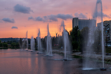 Naklejka premium Fountains music light show on Rusanovka channel in Kyiv, Ukraine. Very beautiful fountains with illumination.