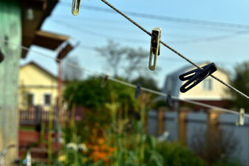 clothespins hanging from a clothesline