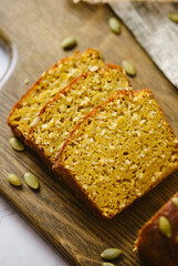Gluten Free Pumpkin bread loaf set white cafe table.