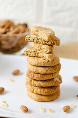 Stack of Gluten Free Almond Cookies set on white cafe table.