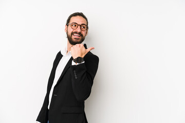 Young caucasian business man isolated on a white background points with thumb finger away, laughing and carefree.