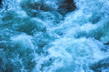 Fototapeta na wymiar Raging water in the river.