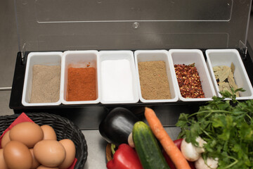 spices in small cups on table 