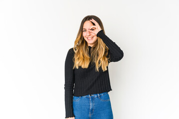 Young caucasian woman isolated on white background excited keeping ok gesture on eye.