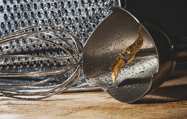 Close-up view of kitchen utensil. Kitchen grater, whisk and blender attachment. - Powered by Adobe
