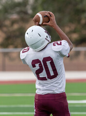 Amazing athletes making great catches and runs during a competitive football game