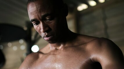 Boxer tying hand wrap in the gym - Powered by Adobe