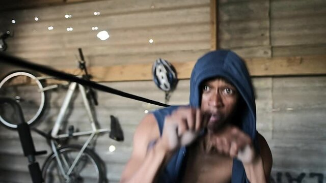 Boxer practicing shadow boxing in the gym