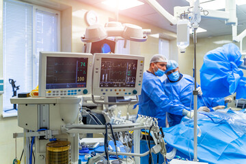 Equipment and medical devices in modern operating room. Operating theatre. Selective focus.