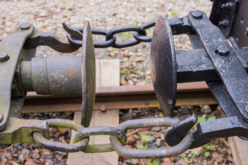 Three-link locomotive chain coupler (rolling stock connection) close up detail. Basic type of coupling on railways (buffer and chain) 