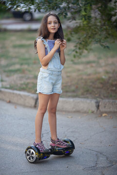 Girl Riding A Hoverboard In The City