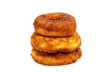 Heap of fried donuts on white background.
