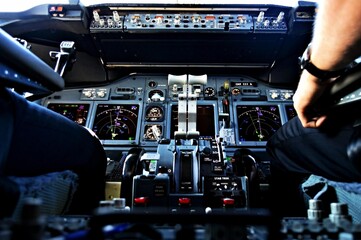 Aircraft cockpit in flight throttle panel view from the jumpseat