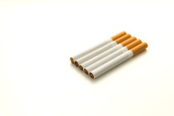 Five cigarettes with yellow filter are lying on a flat white surface. Smoking concept. Close-up and isolated on white background