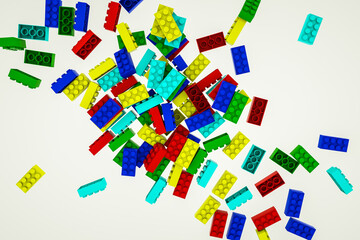 multicolored three-dimensional parts of the children's constructor on a white background. 3d render illustration