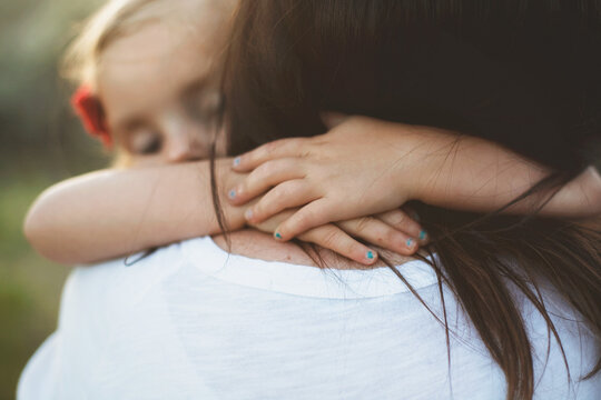 Little girl hugging her mother