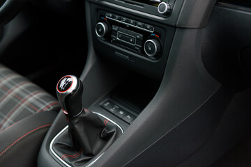 Interior of premium sport car. Manual gear shift knob in a luxury sports car.