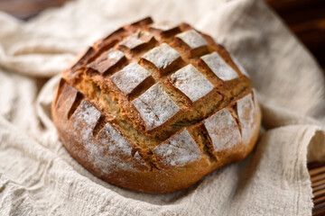 Freshly baked bread on a wooden rustic table