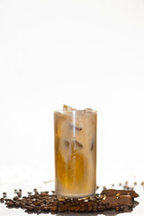 iced coffee in a glass with coffee beans and chocolate 