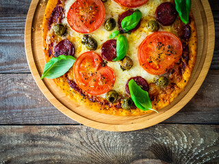 Margherita pizza on wooden background
