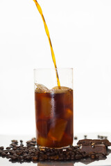 black iced coffee being poured 
