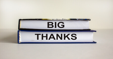 Books with text 'big thanks' on beautiful white table. White background. Business concept. Copy space.