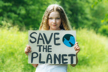 caucasian blonde girl activist with save the planet poster in park. preteen kid volunteer against pollution, global warming, recycle garbage. Ecology environmental problem. Zero waste - Powered by Adobe