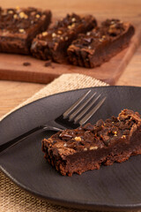 plate with a slice of brownie and a few slices in the background