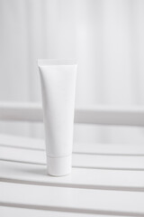 White cosmetic tube on white background, beauty product, brand package mockup