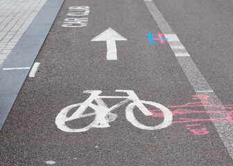 bicycle lane sign in a city and other road signs