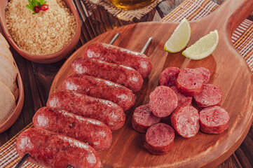 Grilled Sausage skewer on wooden board - Brazilian barbecue