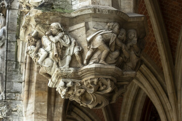 historiated lamp-heads depicting tragic scenes involving aldermen on the Grand Place in Brussels, Belgium