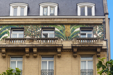 Fototapeta premium banana tree art deco tiles on a facade in Brussels, Belgium
