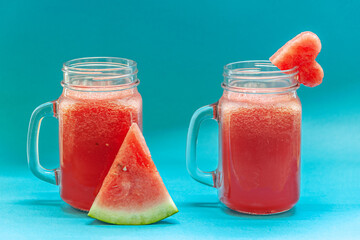 watermelon smoothie in glass mason jars close up