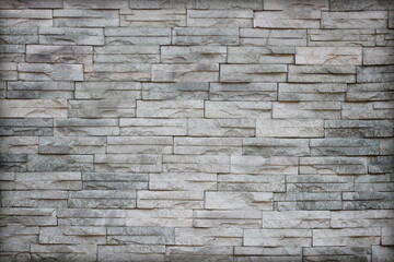 Gray slate wall stone background or texture.