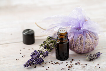 Obraz na płótnie Canvas Aromatherapy composition with lavender essential oil, sachet of dried flowers.