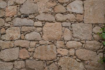 Rustic beige old stone wall