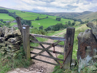 Countryside five bar gate hiking peak district and lake district national parks view of fields and...