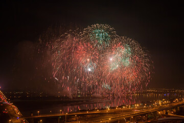 High angel view of the fireworks celebration with Zhongxiao Bridge and Tamsui River