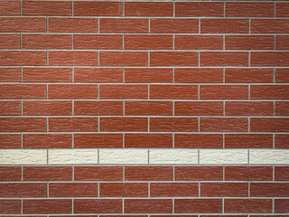 Obraz premium Background modern red brick wall with one line of white bricks