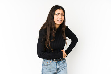 Young indian woman isolated on purple background having a liver pain, stomach ache.