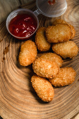 Chicken nuggets on a wooden board. Fast food concept