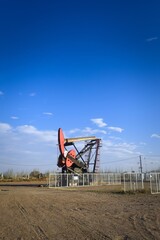 Fototapeta na wymiar Oil extraction pumpjack in the desert of Mendoza, Argentina.