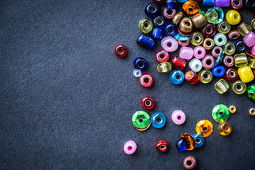 Top view of colorful glass beads with copy space