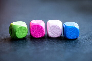 Row of colorful cube beads for lettering macro